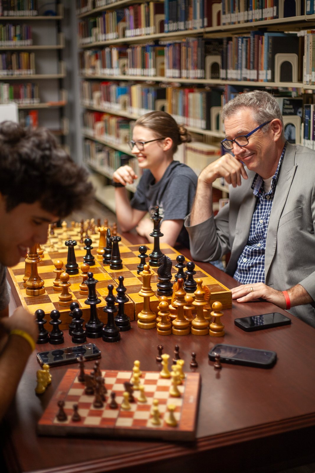 Playing chess with students in the library